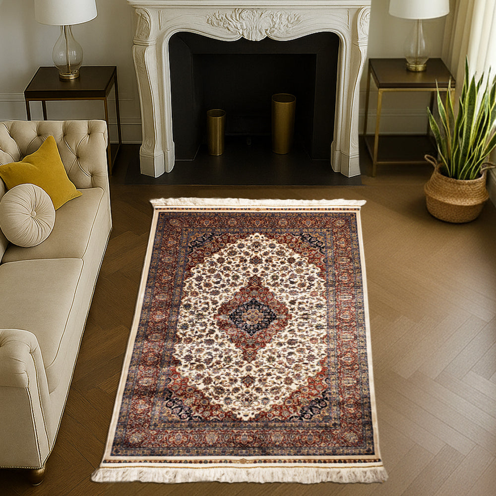 Handwoven Persian silk carpet in golden beige with rich red and blue floral medallion pattern by Dash & Twine